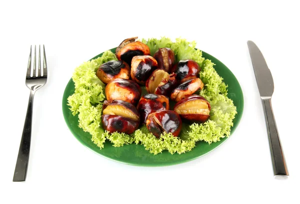 Castañas asadas con lechuga en el plato verde con tenedor e isola cuchillo —  Fotos de Stock