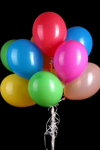 Kleurrijke ballonnen geïsoleerd op zwart — Stockfoto