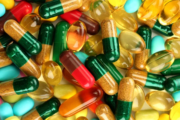 Colorful capsules and pills, close up — Stock Photo, Image