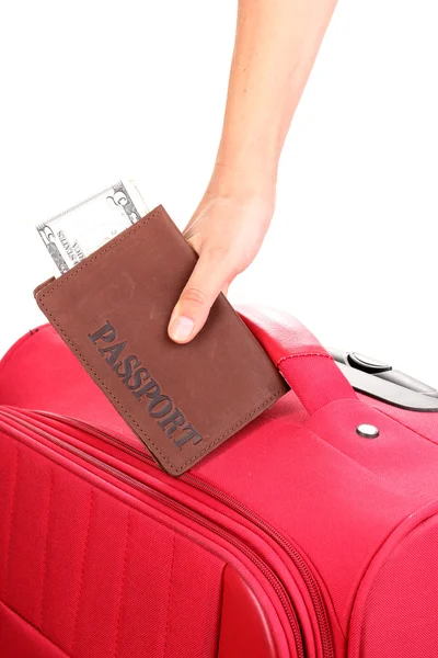 Holding passport and suitcase in hand close-up — Stock Photo, Image