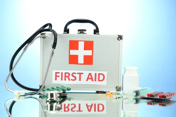 First aid box, on blue background — Stock Photo, Image