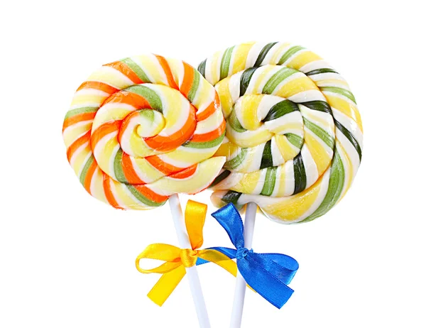 Colorful lollipops with ribbons isolated on white — Stock Photo, Image