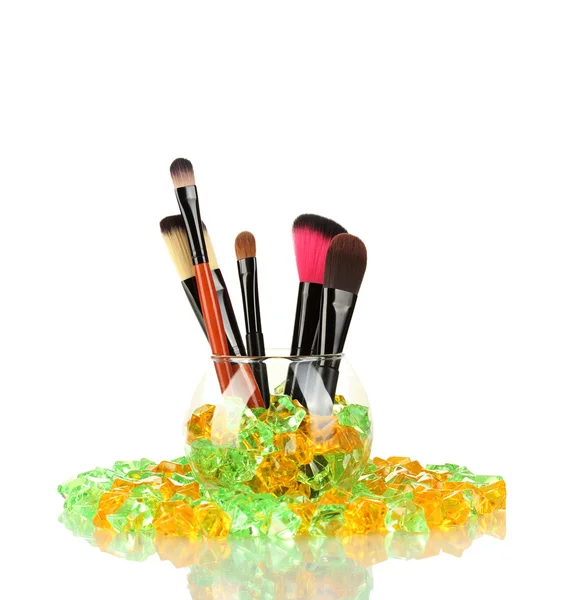 Make-up brushes in a bowl with stones isolated on white — Stock Photo, Image