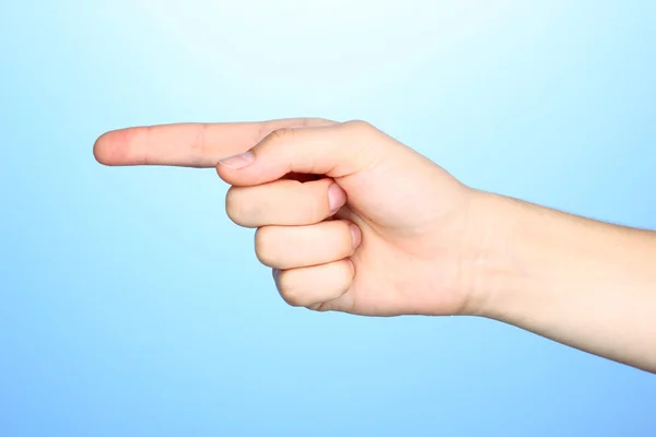 Hand making sign on blue background — Stock Photo, Image