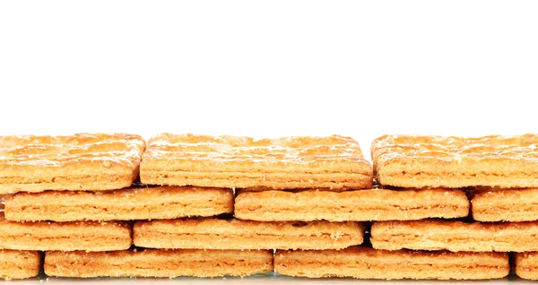 Biscoitos doces na pilha isolados no branco — Fotografia de Stock