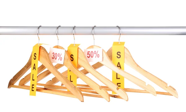 Wooden clothes hangers as sale symbol isolated on white — Stock Photo, Image