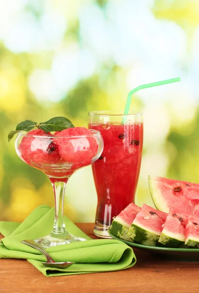 Refreshing desserts of watermelon on green background close-up — Stock Photo, Image