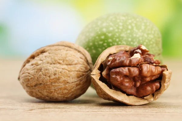 Walnuts, on green background — Stock Photo, Image