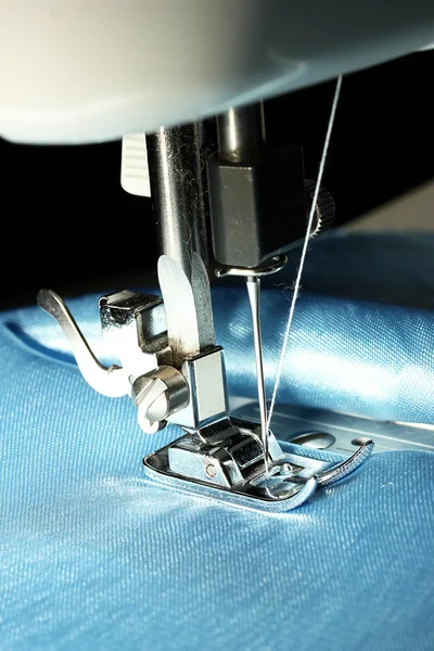 Sewing machine with blue cloth closeup — Stock Photo, Image