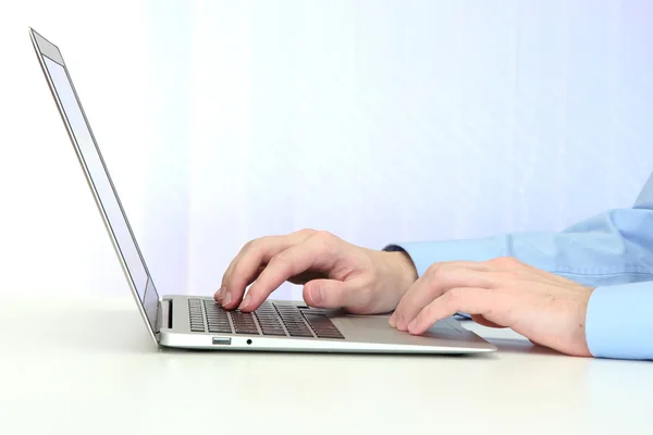 Closeup of businessman hands typing on laptop computer — Stock Photo, Image