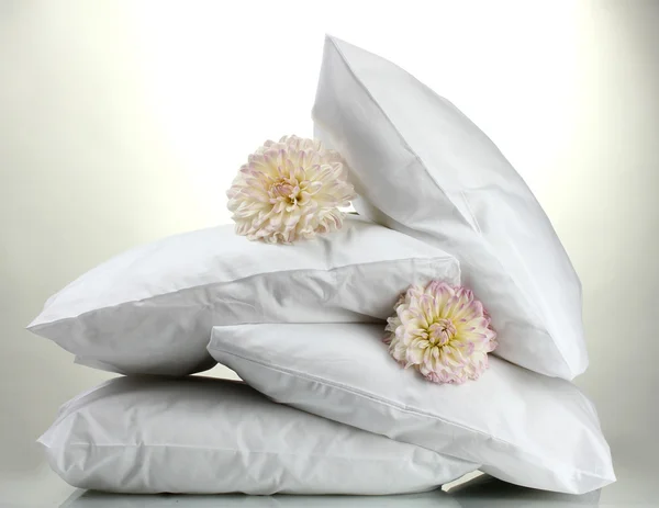 Pillows and flowers, on grey background — Stock Photo, Image