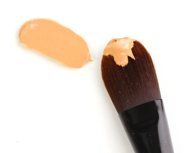 Cosmetic liquid foundation and brush isolated on white — Stock Photo, Image