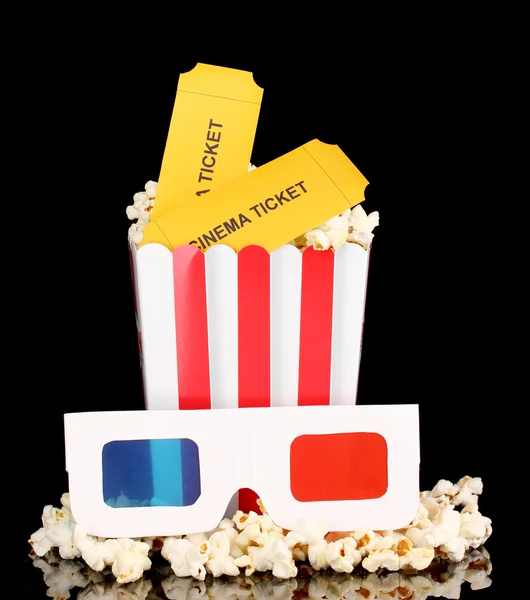 Popcorn with glasses and tickets isolated on black — Stock Photo, Image