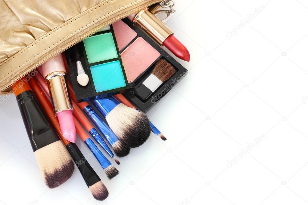 make up bag with cosmetics and brushes isolated on white