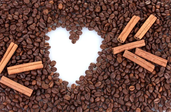 Pattern of heart on coffee beans background. Frame. — Stock Photo, Image