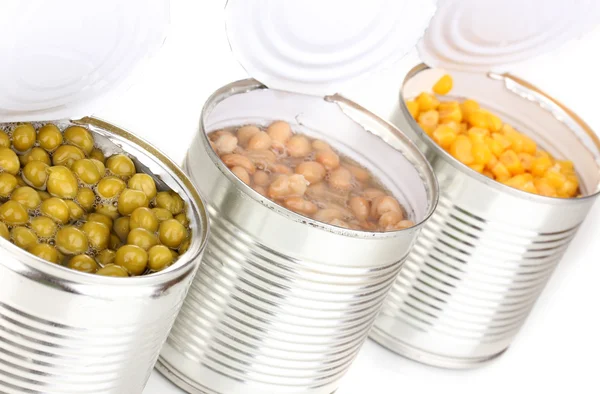 Open tin cans of corn, beans and peas isolated on white — Stock Photo, Image