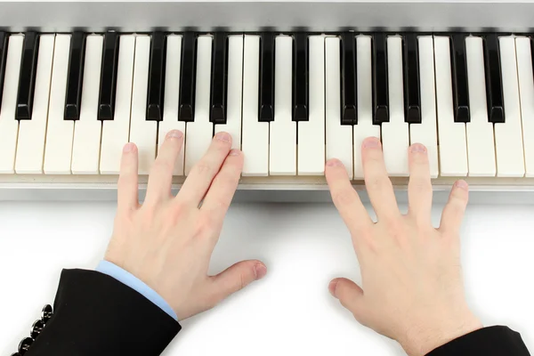 Hands of man playing piano — Stock Photo, Image