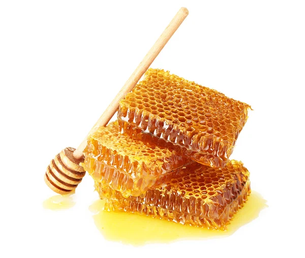 Söt honeycomb och trä drizzler, isolerade på vit — Stockfoto