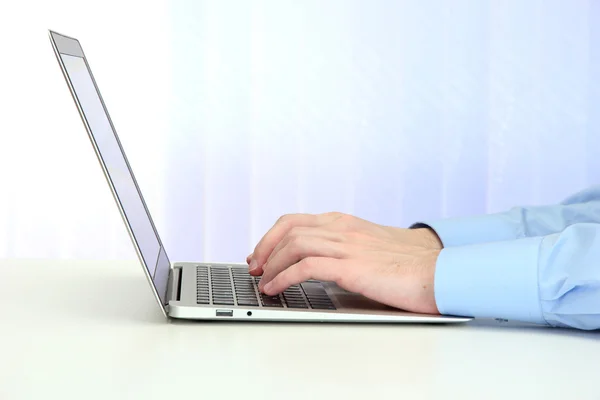 Closeup of businessman hands typing on laptop computer — Stock Photo, Image