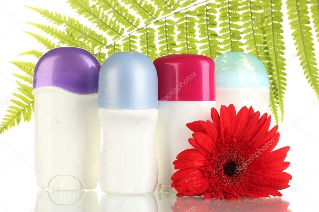 deodorants with flower and green leaf isolated on white