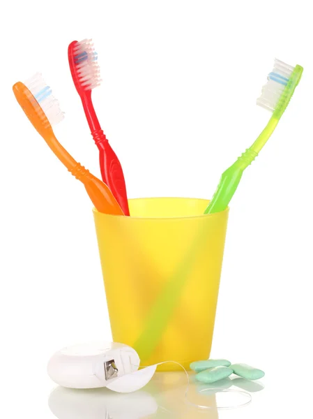 Toothbrushes, chewing gum and dental floss isolated on white — Stock Photo, Image