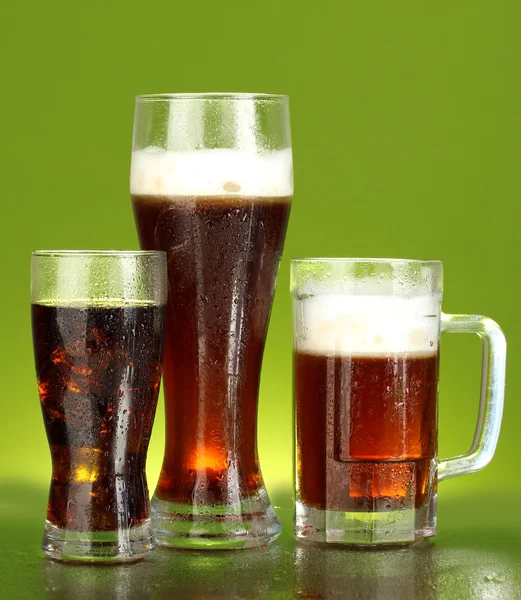 Refreshments - beer, cola and kvass on green background — Stock Photo, Image