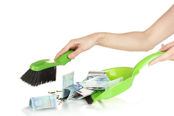 Sweeps money in the shovel on white background close-up — Stock Photo, Image