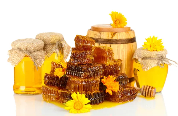 Sweet honeycombs, barrel and jars with honey, isolated on white — Stock Photo, Image