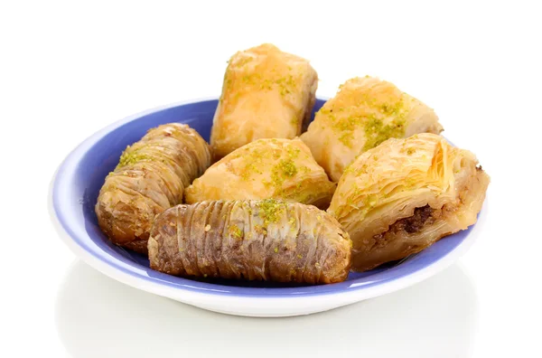 Sweet baklava on plate isolated on white — Stock Photo, Image