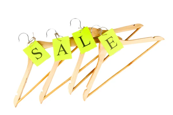 Coat hangers with sale tag isolated on white background — Stock Photo, Image