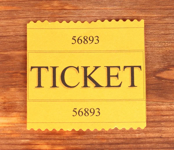 Colorful ticket on wooden background close-up — Stock Photo, Image