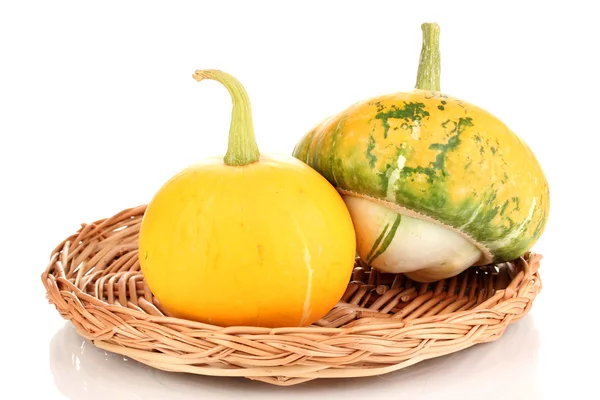 Two pumpkins on wicker mat isolated on white — Stock Photo, Image