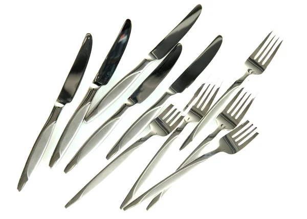Un conjunto de cuchillos y tenedores aislados en blanco — Foto de Stock