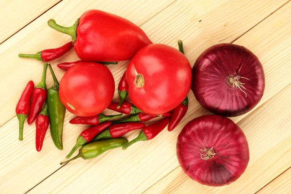 Fresh red vegetables on wooden background — Stock Photo, Image