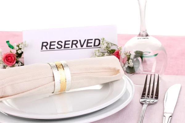 Table setting with reserved card in restaurant — Stock Photo, Image