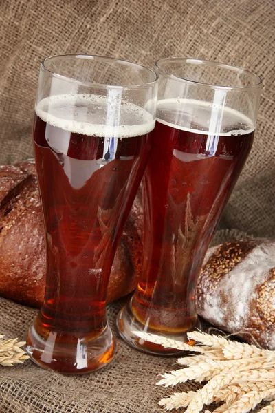 Two glasses of kvass with bread on canvas background close-up — Stock Photo, Image