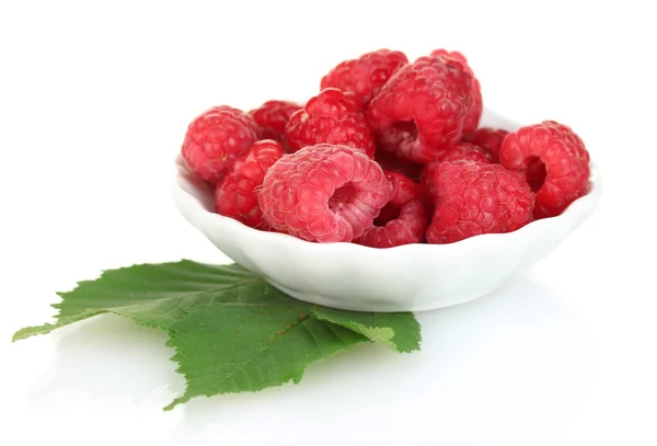 Fresh raspberries in white saucer isolated on white — Stock Photo, Image