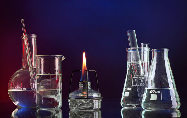 spiritlamp and test-tubes on blue-red background