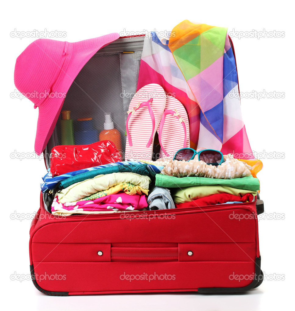 Red travel suitcase with personal belongings isolated on white