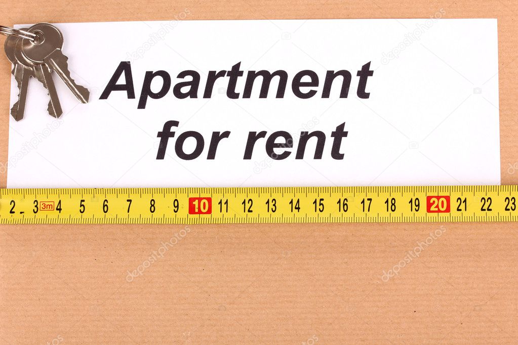 folder with information on apartments for rent on wooden background close-u