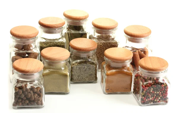 Powder spices in glass jars isolated on white — Stock Photo, Image