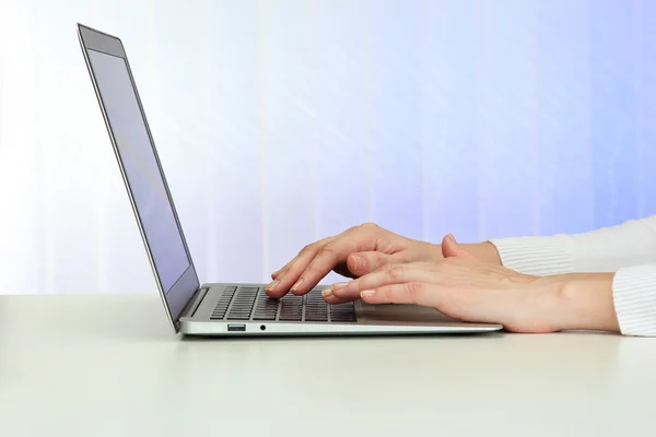 Closeup of businesswoman hands typing on laptop computer Stock Picture