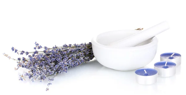 Lavender flowers with mortar and candles isolated on white — Stock Photo, Image