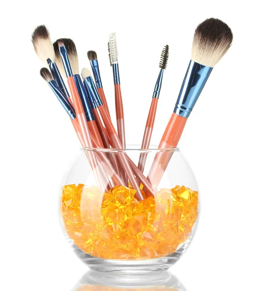 Make-up brushes in a bowl with stones isolated on white — Stock Photo, Image
