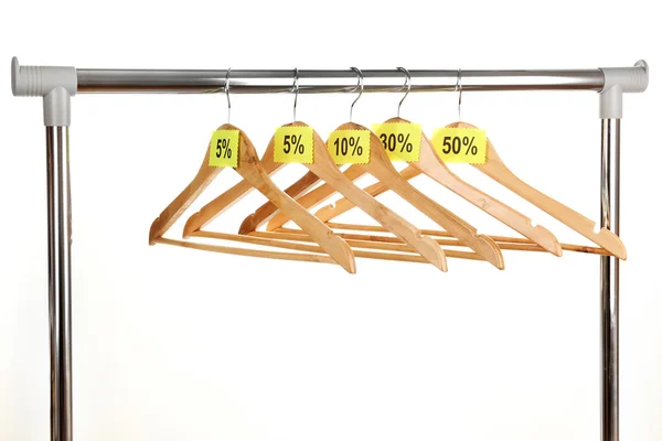 Wooden clothes hangers as sale symbol isolated on white — Stock Photo, Image