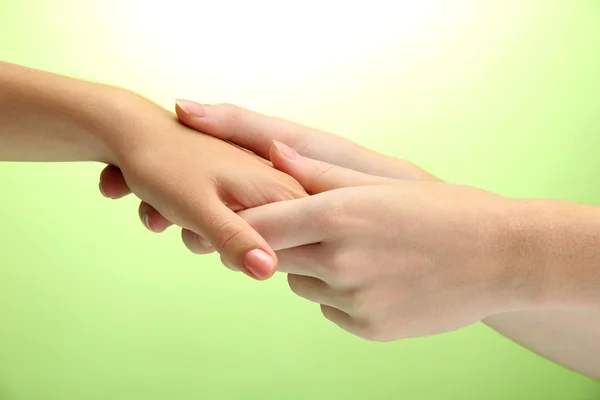 Hand massage, on green background — Stock Photo, Image