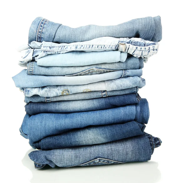 Lot of different blue jeans isolated on white — Stock Photo, Image