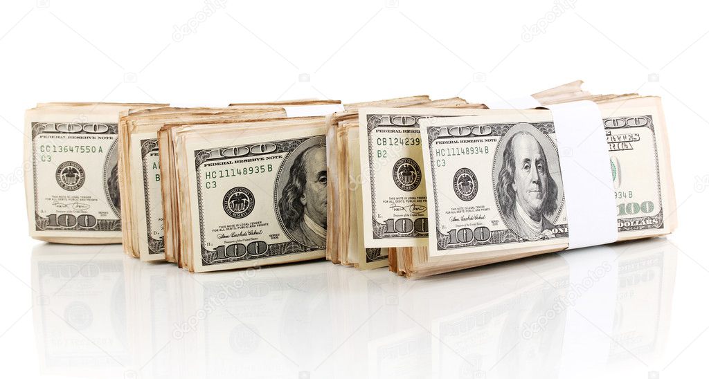 Many one hundred dollars banknotes close-up isolated on white