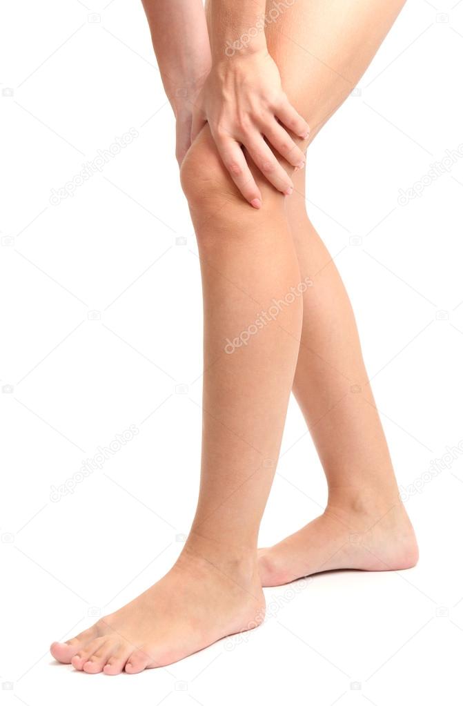 woman holding sore leg, isolated on white