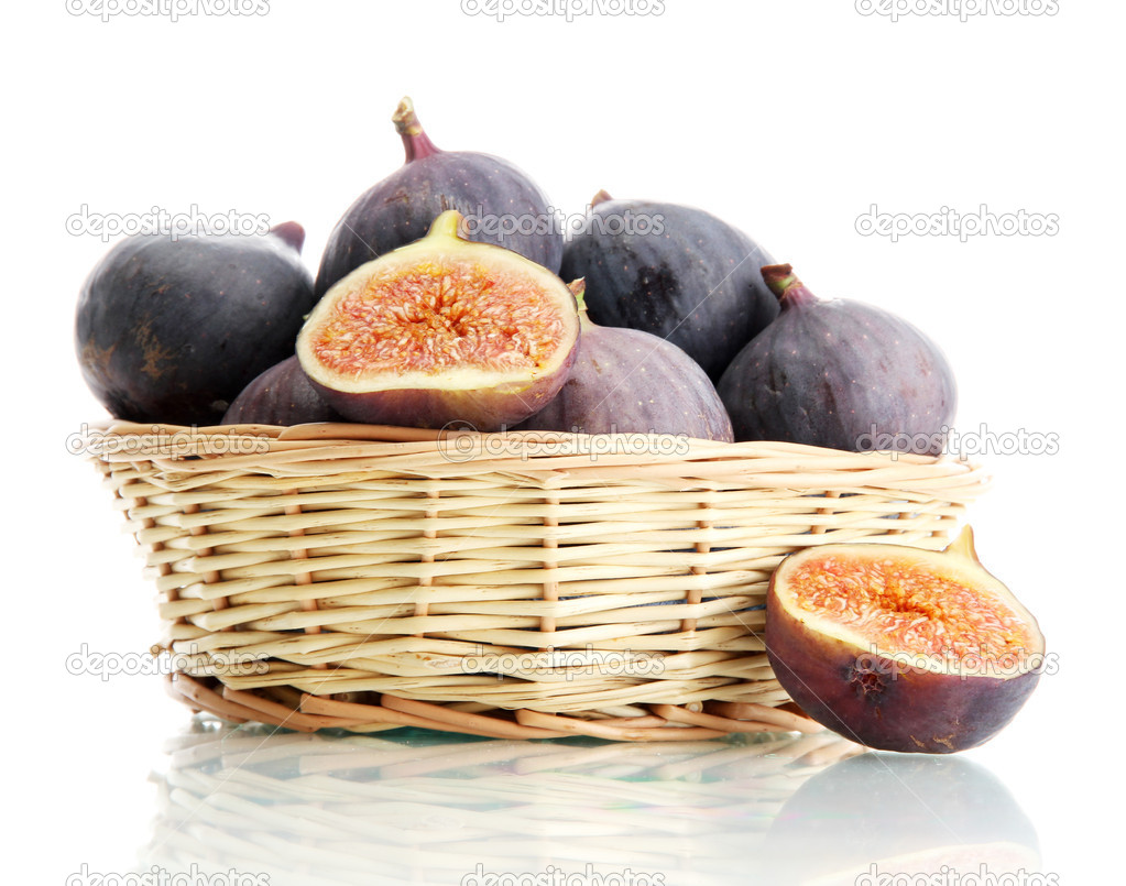 Ripe sweet figs in basket isolated on white